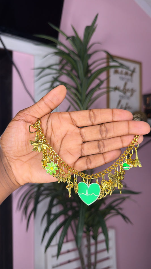 Green mixed charm bracelet (size medium 7inch)