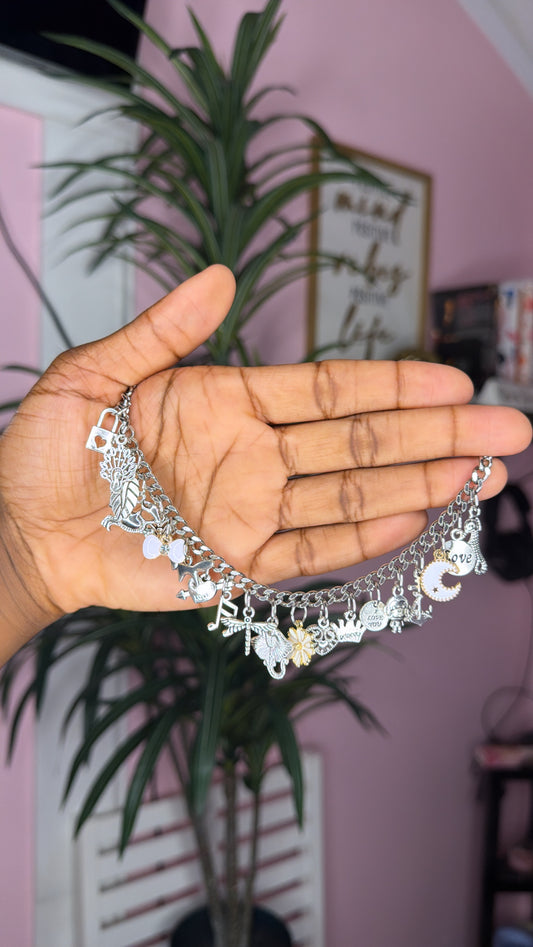 White mixed charm bracelet (size medium 7inch)